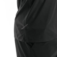 Close-up of a black garment with a tape on a white background. 